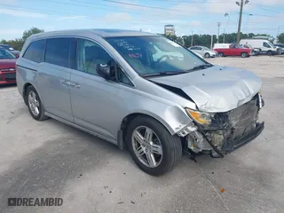 2011 Honda Odyssey Touring with VIN 5FNRL5H9XBB013213, listed as a IAAI auction lot 41934875 with 220,525 mi miles. Bid and sale history available at carsss.com. Image 1.