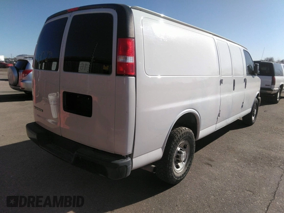 2020 Chevrolet Express Cargo Van with VIN 1GCWGBFP6L1146097, listed as a IAAI auction lot 41711459 with 68,793 mi miles. Bid and sale history available at carsss.com. Image 4.