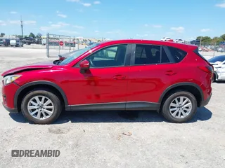 2016 Mazda CX-5 Touring with VIN JM3KE2CY6G0830409, listed as a IAAI auction lot 42049299 with 39,317 mi miles. Bid and sale history available at carsss.com. Image 14.