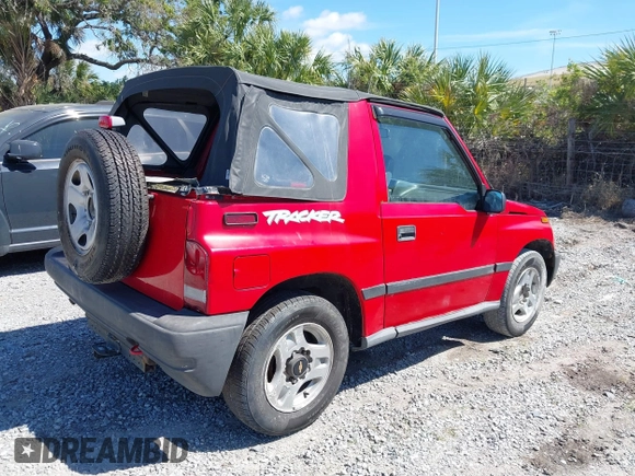 1998 Chevrolet Tracker z VIN 2CNBE1866W6924835, wystawiony jako IAAI lot #41821459 z przebiegiem 54 512 mil mil oraz . Historia ofert i sprzedaży dostępna na DreamBid. Obrazek 4.