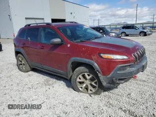 2014 Jeep Cherokee Trailhawk with VIN 1C4PJMBS7EW157305, listed as a Copart auction lot 49436685 with 138,446 mi miles and Salvage Title. Bid and sale history available at carsss.com. Image 4.