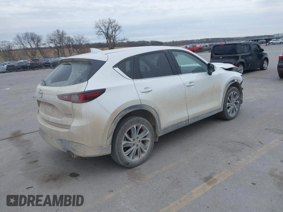 2023 Mazda CX-5 2.5 S Premium Plus Package with VIN JM3KFBEMXP0103278, listed as a IAAI auction lot 40954999 with 100,798 mi miles. Bid and sale history available at carsss.com. Image 4.