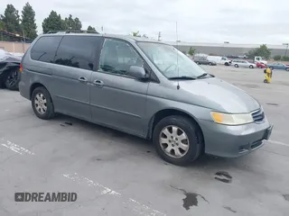 2002 Honda Odyssey EX-L z VIN 2HKRL18922H542116, wystawiony jako IAAI lot #42130335 z przebiegiem 205 053 mil mil oraz . Historia ofert i sprzedaży dostępna na DreamBid. Obrazek 1.