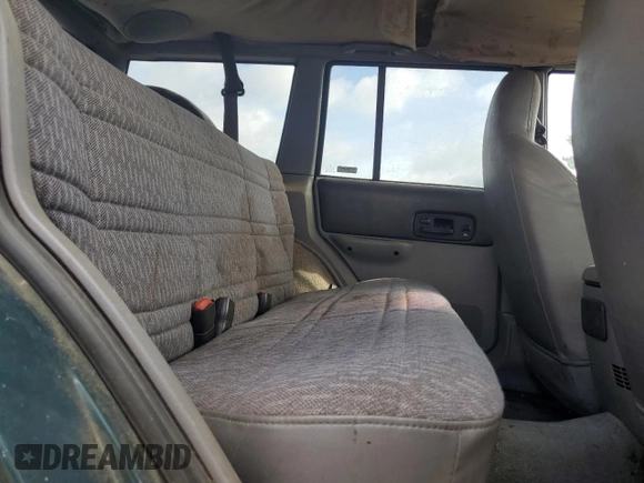1998 Jeep Cherokee Sport with VIN 1J4FJ68S9WL249365, listed as a Copart auction lot 58896155 with 344,530 mi miles and Clean title. Bid and sale history available at DreamBid. Image 11.