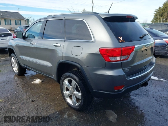 2013 Jeep Grand Cherokee Overland with VIN 1C4RJFCG8DC581719, listed as a IAAI auction lot 41566666 with 152,332 mi miles. Bid and sale history available at carsss.com. Image 3.