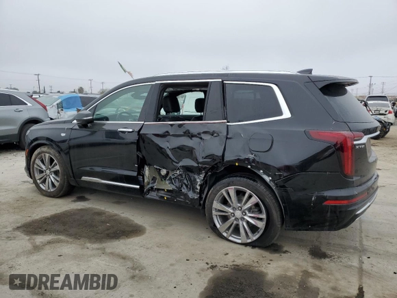 2023 Cadillac XT6 FWD Premium Luxury z VIN 1GYKPCRS5PZ119186, wystawiony jako Copart lot #50577175 z przebiegiem 32 189 mil mil oraz Szkoda całkowita • Salvage title. Historia ofert i sprzedaży dostępna na DreamBid. Obrazek 2.