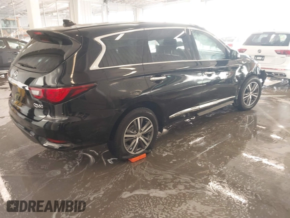 2020 Infiniti QX60 Pure with VIN 5N1DL0MN3LC533814, listed as a IAAI auction lot 41077349 with 79,377 mi miles and . Bid and sale history available at DreamBid. Image 4.