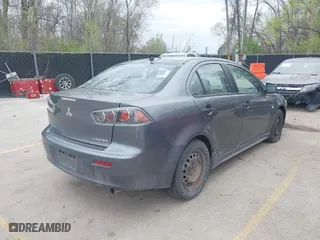 2010 Mitsubishi Lancer DE with VIN JA32U1FU7AU005962, listed as a IAAI auction lot 41927652 with 218,829 mi miles. Bid and sale history available at carsss.com. Image 4.