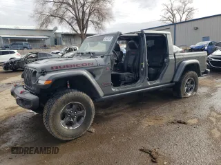 2020 Jeep Gladiator Rubicon z VIN 1C6JJTBG0LL168681, wystawiony jako Copart lot #87429764 z przebiegiem Nie podano mil oraz Szkoda całkowita • Salvage title. Historia ofert i sprzedaży dostępna na DreamBid. Obrazek 1.