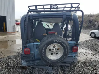1998 Jeep Wrangler Sport z VIN 1J4FY19S8WP788484, wystawiony jako Copart lot #50835275 z przebiegiem Nie podano mil oraz Szkoda całkowita • Salvage title. Historia ofert i sprzedaży dostępna na DreamBid. Obrazek 6.