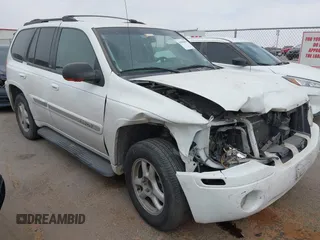 2003 GMC Envoy SLE with VIN 1GKDS13S532253648, listed as a IAAI auction lot 41850094 with 147,254 mi miles. Bid and sale history available at carsss.com. Image 1.