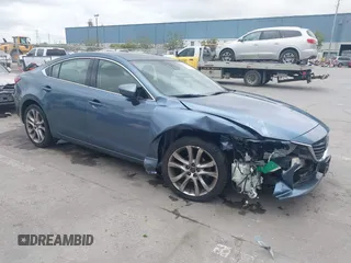 2014 Mazda 6 i Grand Touring with VIN JM1GJ1W64E1133729, listed as a IAAI auction lot 42050222 with 112,464 mi miles and . Bid and sale history available at DreamBid. Image 1.