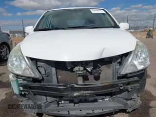 2009 Nissan Versa 1.8 S with VIN 3N1BC13E19L371006, listed as a IAAI auction lot 42064633 with 67,424 mi miles. Bid and sale history available at carsss.com. Image 13.