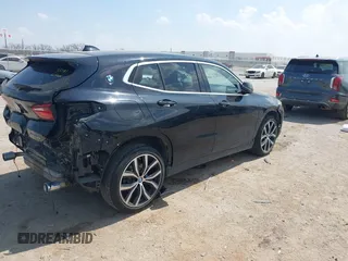 2018 BMW X2 xDrive28i with VIN WBXYJ5C33JEF80454, listed as a IAAI auction lot 41876188 with 34,596 mi miles. Bid and sale history available at carsss.com. Image 4.