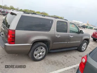 2011 Chevrolet Suburban LTZ with VIN 1GNSKKE32BR197356, listed as a IAAI auction lot 42052377 with 248,574 mi miles and . Bid and sale history available at DreamBid. Image 13.