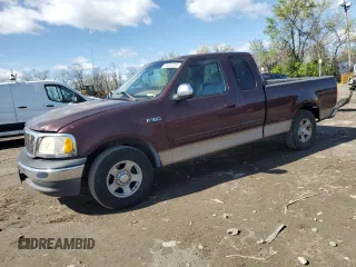 2001 Ford F-150 XL with VIN 1FTZX17211NA57151, listed as a Copart auction lot 52007315 with 279,457 mi miles and Salvage title. Bid and sale history available at DreamBid. Image 1.