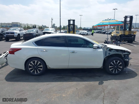 2018 Nissan Altima 2.5 SV with VIN 1N4AL3AP4JC186544, listed as a IAAI auction lot 41892390 with 113,384 mi miles. Bid and sale history available at carsss.com. Image 14.
