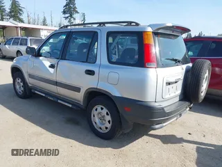 1999 Honda CR-V LX with VIN JHLRD1840XC057285, listed as a IAAI auction lot 42126071 with 99,000 mi miles. Bid and sale history available at carsss.com. Image 3.