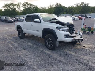 2022 Toyota Tacoma SR with VIN 3TMCZ5AN3NM479450, listed as a IAAI auction lot 42423677 with 66,665 mi miles and . Bid and sale history available at DreamBid. Image 1.