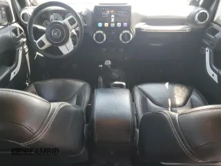 2014 Jeep Wrangler Unlimited Sahara with VIN 1C4BJWEG8EL236951, listed as a Copart auction lot 61046575 with 146,642 mi miles and Salvage title. Bid and sale history available at DreamBid. Image 8.