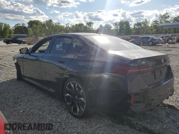 2024 BMW i5 eDrive40 with VIN WBY33FK04RCR49355, listed as a Copart auction lot 55828475 with Not Provided miles and Salvage Title. Bid and sale history available at DreamBid. Image 2.
