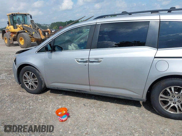 2012 Honda Odyssey EX-L with VIN 5FNRL5H61CB081634, listed as a IAAI auction lot 42760909 with 197,949 mi miles and . Bid and sale history available at DreamBid. Image 21.