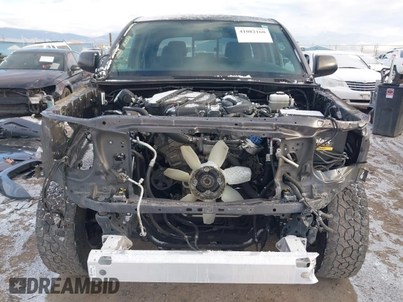 2015 Toyota Tacoma z VIN 3TMLU4EN8FM177785, wystawiony jako IAAI lot #41082160 z przebiegiem 156 761 mil mil oraz . Historia ofert i sprzedaży dostępna na DreamBid. Obrazek 13.