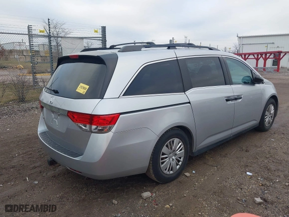 2014 Honda Odyssey LX with VIN 5FNRL5H22EB026657, listed as a IAAI auction lot 41114634 with 132,125 mi miles. Bid and sale history available at carsss.com. Image 4.