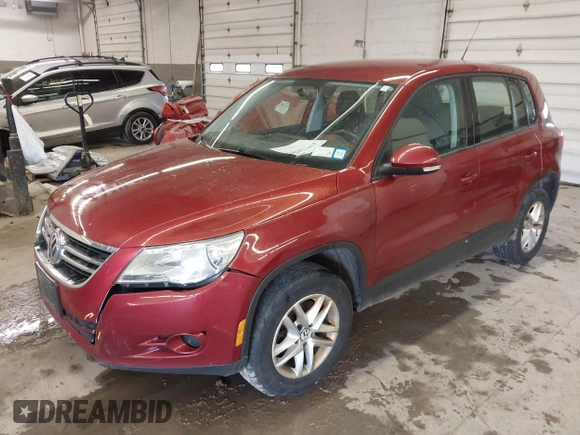 2011 Volkswagen Tiguan SE with VIN WVGBV7AX9BW000461, listed as a IAAI auction lot 42032028 with 149,896 mi miles and . Bid and sale history available at DreamBid. Image 2.