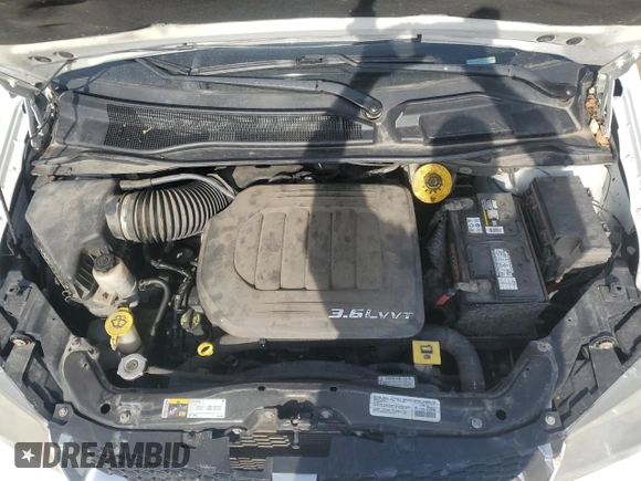 2014 Dodge Grand Caravan American Value with VIN 2C4RDGBG8ER245897, listed as a Copart auction lot 54066945 with 144,177 mi miles and Clean Title. Bid and sale history available at DreamBid. Image 12.