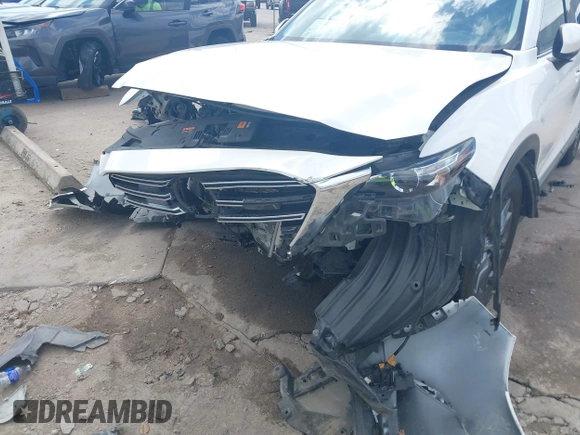 2022 Mazda CX-9 Touring with VIN JM3TCBCY0N0608052, listed as a IAAI auction lot 42027465 with 65,313 mi miles and . Bid and sale history available at DreamBid. Image 6.
