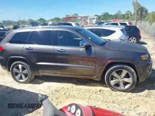 2014 Jeep Grand Cherokee Overland with VIN 1C4RJECG8EC409976, listed as a IAAI auction lot 41821685 with 186,105 mi miles. Bid and sale history available at carsss.com. Image 13.