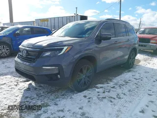 2022 Honda Pilot Special Edition with VIN 5FNYF6H20NB063506, listed as a IAAI auction lot 41239636 with 59,752 mi miles. Bid and sale history available at carsss.com. Image 2.