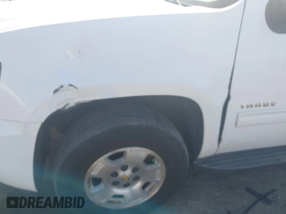 2014 Chevrolet Tahoe LT with VIN 1GNSCBE06ER233105, listed as a IAAI auction lot 41753190 with 161,056 mi miles and . Bid and sale history available at DreamBid. Image 6.