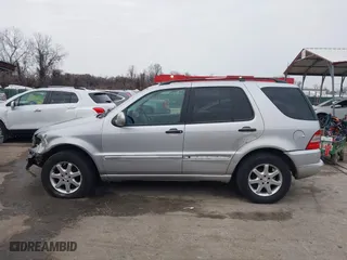 1999 Mercedes-Benz M-Class with VIN 4JGAB72E4XA113675, listed as a IAAI auction lot 41554604 with 230,092 mi miles. Bid and sale history available at carsss.com. Image 14.