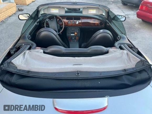 1999 Jaguar XK z VIN SAJGX204XXC041660, wystawiony jako Copart lot #88755785 z przebiegiem 70 091 mil mil oraz Tytuł czysty. Historia ofert i sprzedaży dostępna na DreamBid. Obrazek 9.