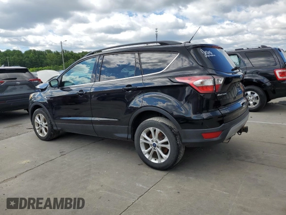 2017 Ford Escape SE z VIN 1FMCU0G93HUF10560, wystawiony jako Copart lot #57973915 z przebiegiem 127 444 mil mil oraz Czysty tytuł • Clean title. Historia ofert i sprzedaży dostępna na DreamBid. Obrazek 2.