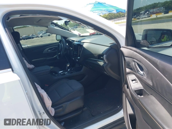 2021 Chevrolet Traverse LS with VIN 1GNERFKWXMJ201136, listed as a IAAI auction lot 42254422 with 50,663 mi miles and . Bid and sale history available at DreamBid. Image 5.
