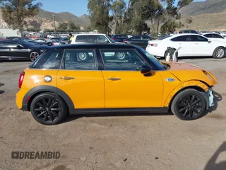 2015 MINI Hardtop 4 Door S z VIN WMWXU3C51F2B57061, wystawiony jako IAAI lot #41691431 z przebiegiem 66 406 mil mil oraz . Historia ofert i sprzedaży dostępna na DreamBid. Obrazek 14.