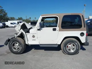 2001 Jeep Wrangler Sahara with VIN 1J4FA59S51P332107, listed as a IAAI auction lot 40954726 with 150,671 mi miles. Bid and sale history available at carsss.com. Image 14.