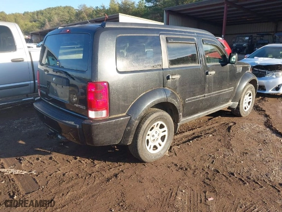 2009 Dodge Nitro SE with VIN 1D8GT28KX9W518412, listed as a IAAI auction lot 41458414 with 178,308 mi miles. Bid and sale history available at carsss.com. Image 4.