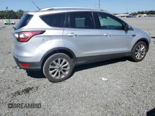 2017 Ford Escape Titanium with VIN 1FMCU0J90HUB04082, listed as a Copart auction lot 77814994 with 135,674 mi miles and Salvage Title. Bid and sale history available at carsss.com. Image 3.