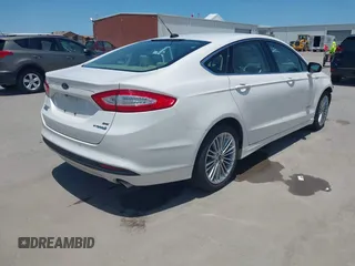 2014 Ford Fusion SE Hybrid with VIN 3FA6P0LUXER233658, listed as a IAAI auction lot 42311588 with 106,282 mi miles and . Bid and sale history available at DreamBid. Image 4.