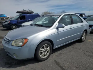 2005 Kia Spectra LX with VIN KNAFE121255140694, listed as a Copart auction lot 49927755 with 74,794 mi miles and Salvage Title. Bid and sale history available at carsss.com. Image 1.