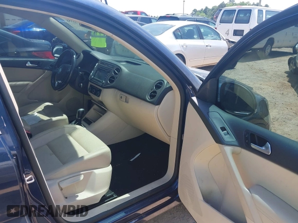 2012 Volkswagen Tiguan SE with VIN WVGAV7AX7CW534703, listed as a IAAI auction lot 42463358 with 119,699 mi miles and . Bid and sale history available at DreamBid. Image 5.