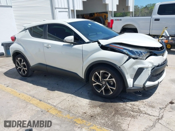 2021 Toyota C-HR LE with VIN JTNKHMBX8M1104427, listed as a IAAI auction lot 41948234 with 24,415 mi miles. Bid and sale history available at carsss.com. Image 1.