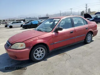 1999 Honda Civic LX with VIN 1HGEJ6670XL002593, listed as a Copart auction lot 68564474 with 255,621 mi miles and Salvage Title. Bid and sale history available at carsss.com. Image 1.