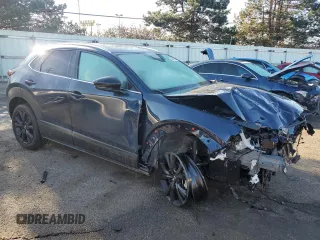 2023 Mazda CX-30 Premium Plus with VIN 3MVDMBEY9PM557107, listed as a Copart auction lot 46893065 with 10,404 mi miles and Salvage title. Bid and sale history available at DreamBid. Image 4.