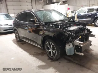 2016 BMW X1 xDrive28i with VIN WBXHT3C33GP886935, listed as a IAAI auction lot 41707367 with 73,201 mi miles. Bid and sale history available at carsss.com. Image 1.