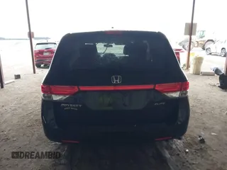 2014 Honda Odyssey Touring with VIN 5FNRL5H98EB095835, listed as a IAAI auction lot 42153412 with 124,131 mi miles and . Bid and sale history available at DreamBid. Image 17.